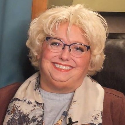 Tammy Kabell at her desk 2022 Light - square tight