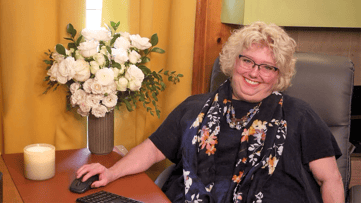 Tammy at her desk for Summer Sig Block