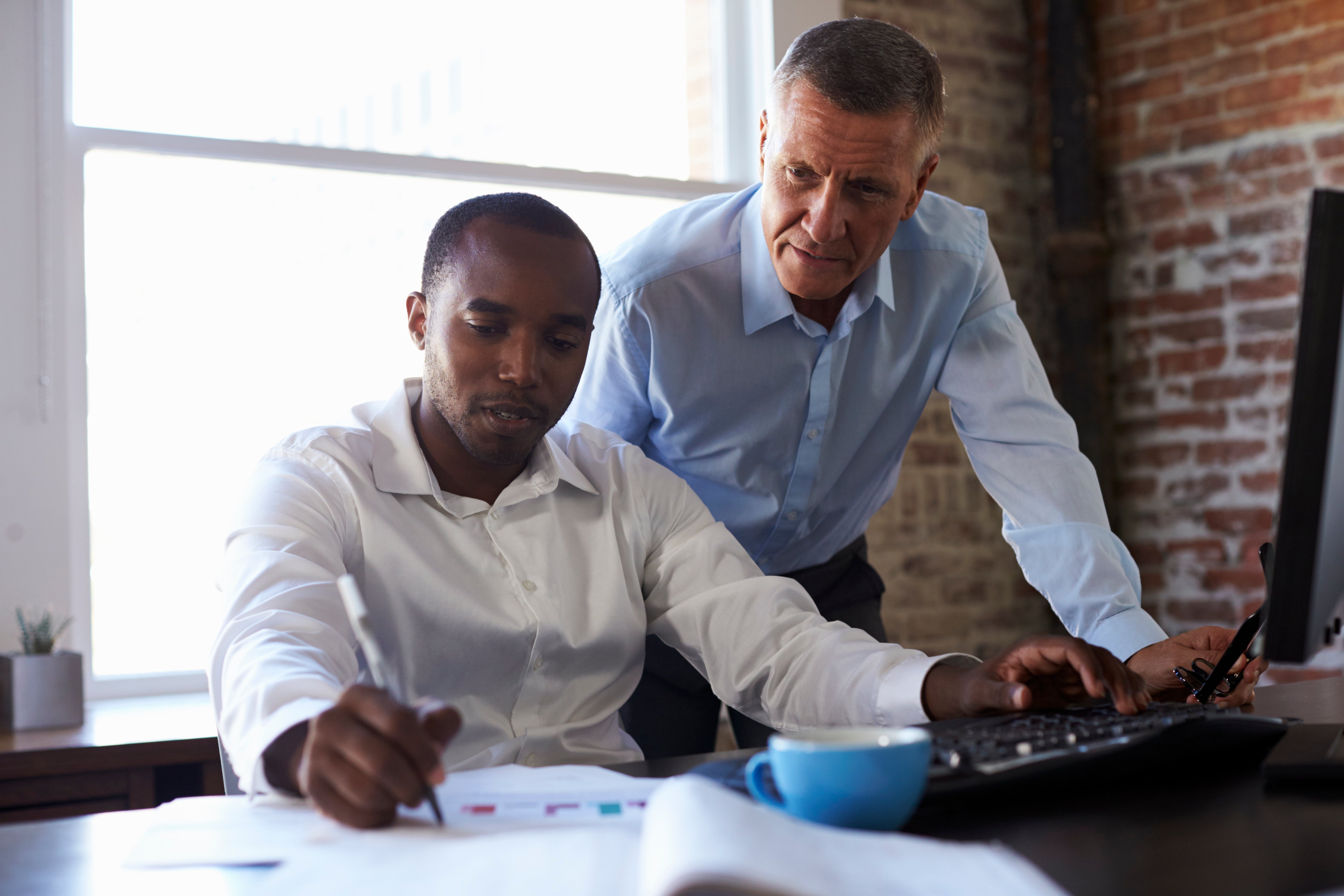 businessmen-working-on-computer-in-office.jpg