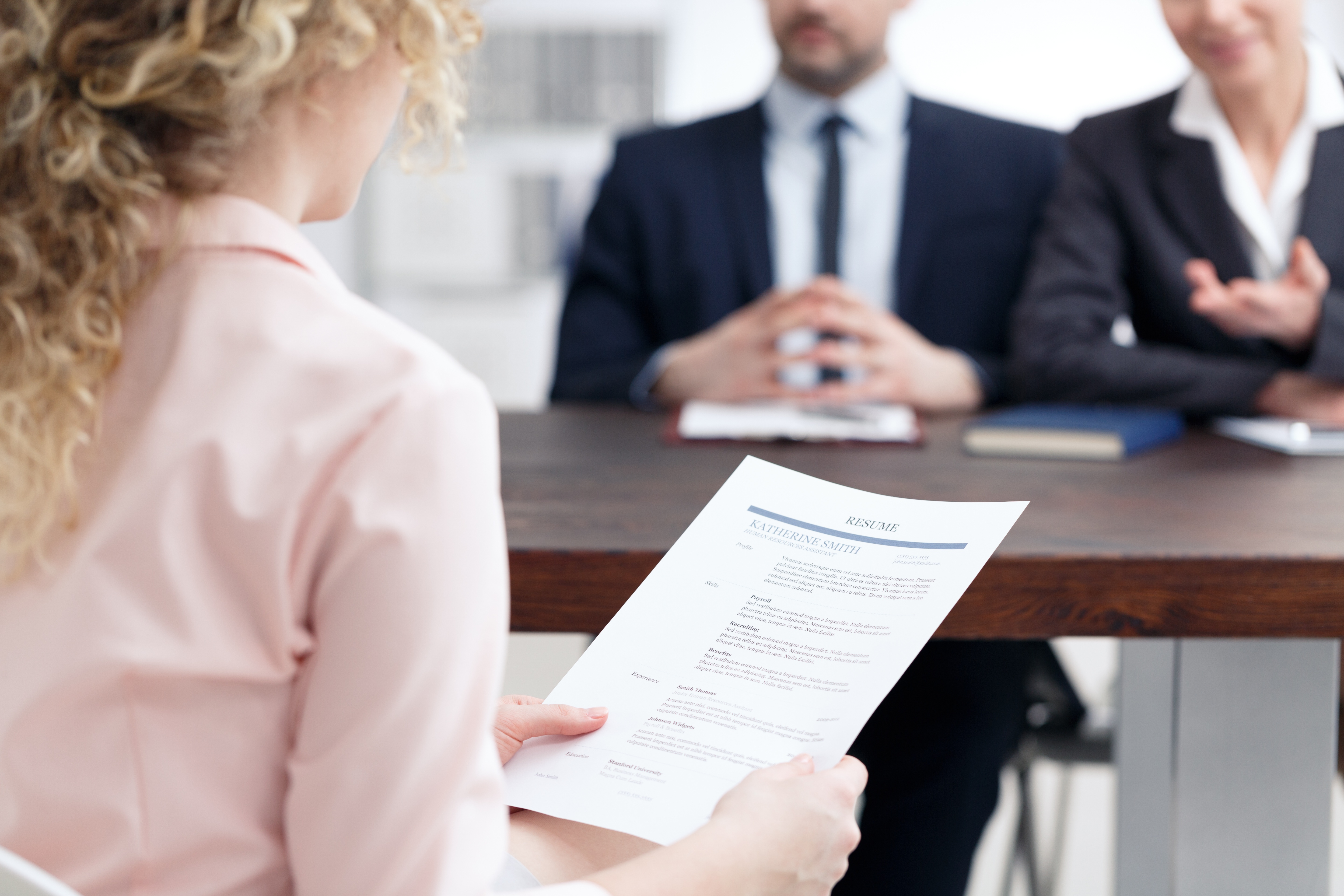 woman-holding-her-resume-PU6MTAR